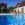 Lecomte Hydrobulles - Piscine 10 x 4 m avec plage en pierre naturelle Travertin